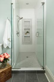Wood flooring and concrete walls add an industrial touch to this bathroom, while the glass shower surround allows light to pass through. Marble Mosaic Shower Floor