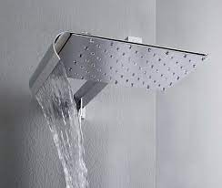 Glass shower enclosure and rainfall shower head, modern bathroom design with glass wall adjacent to bedroom. Bathrooms Design Ideas Inspiration Photos Trendir Shower Heads Modern Shower Head Rain Shower Head