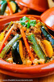 Lamb, beef, or chicken is stewed with assorted veggies, then served atop a mound of light, fluffy steamed couscous. Moroccan Lamb Stew Cauliflower Couscous The Delicious Crescent