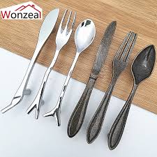 Make a spoon cabinet handle from a vintage silver spoon. Hole Cc 76mm Drawer Knobs Kitchen Handles Creative Knife Spoon Fork Design Kitchen Cabinet Handles Unique Cupboard Knobs Fashion Cabinet Pulls Aliexpress
