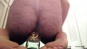 Guy pleases himself with wine bottle up his ass: anal insertion, fisting