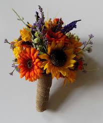 The flowers contrast nicely with blue blossoms, or you can pair them with the classic fall. Wildflower Bouquet With Sunflowers Google Search Bridal Bouquet Fall Wildflower Wedding Bouquet Sunflower Wedding Bouquet