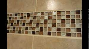 One of our favourite tile ideas for small bathrooms and cloakrooms embraces the use of the bath in making a room feel more spacious. Bathroom Glass Mosaic Tile Designs Youtube