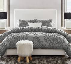 Footboard and rails are also beautifully dressed in the rich gray fabric with warm brown undertones. Raleigh Square Upholstered Tall Bed Pottery Barn