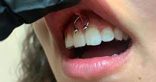 The World Famous Emerald Tattoo And Piercing In Business Since 2007 Smiley Piercing Piercing Tattoos And Piercings