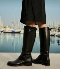 prada on instagram boots made for anything logo embossed leather waders with adjustable straps discover more via link in bio creative direction