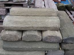 Coping stones, also known as 'capping stones' or 'wall caps', present a stylish and protective finish to any wall or raised stonework. Reclamation Concrete Chamfered Weathered Coping Stones