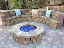 Maybe you would like to learn more about one of these? Firepit With Stone Wall Seating Pavestone Highland Wall In Sandstone Patio Stones Stone Patio Designs Paver Stones