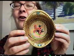 Coiling a pine needle basket around a manatee ring