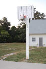 Instead, a backboard can be purchased more cheaply, or even just a hoop that can be mounted on a homemade backboard. Kids Love The Hoosiers Style Basketball Goal Made With Salvaged Utility Pole And Cantilevered Wood Pall Diy Basketball Hoop Diy Space Basketball Court Backyard