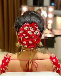 28 Colourful Floral Bun Hairstyles For Intimate Weddings That Are Fresh Elegant Wedding Bun Hairstyles Bridal Hair Buns Bun Hairstyles