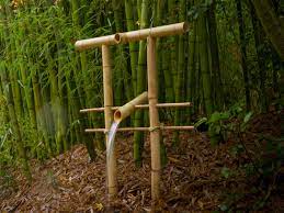 Bamboo is used for a water spout and sluices, ending up in a small pond. Diy Bamboo Fountain Scares Scavenging Critters Make