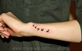 Bird Tattoo On Hand Meaning Woman S Outer Forearm And Wrist Flying Birds Tattoo Forearm Tattoo Women Outer Forearm Tattoo Small Bird Tattoos