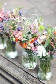 Mason Jars And Wildflowers For Outdoor Wedding Glasses Wedding Decor Rustic Wedding Wild Flower Arrangements Spring Wedding Centerpieces Flower Arrangements