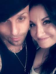 Pawn shop neighbors mourn, police hunt suspects