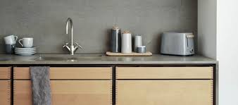 This white kitchen features black and grey accents which give it a stylish almost art deco feel. Kitchen Accessories Designers Avenue