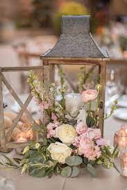 Swing From The Chandeliers At This Winery Wedding In California Lantern Centerpiece Wedding Wedding Floral Centerpieces Wedding Table Centerpieces