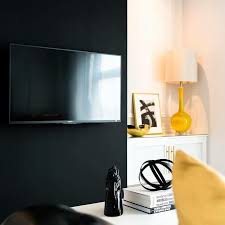 Black Accent Wall Living Room Tv Black And Yellow Living Room With A Black Accent Wall Lined With A Flatscreen Tv Nex Yellow Living Room Black And White Living Room Accent Walls In Living Room