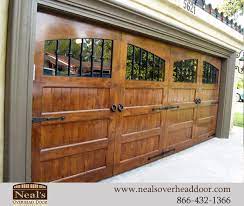 Timber is a beautiful natural material and is it always worth remembering that images in brochures, on websites or photographs of timber garage doors you have seen and like may not always be reproduced exactly the same in another door. Tuscan Style Custom Garage Doors Designs And Installation Southern California Orange County Irvine T Garage Door Design Garage Doors Wooden Garage Doors
