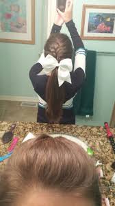 Cheer hairstyles are so fun to do for young girls. French Braid Into Low Pony For Cheer Braided Cheer Hair Cheer Ponytail Cheerleading Hairstyles