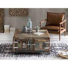 The base consists of weathered palette wood salvaged from outside an abandoned warehouse and the top is scrap redwood siding. Reclaimed Wood Coffee Table On Wheels