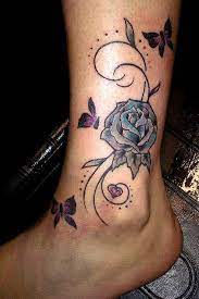 Purple Flower And Flying Butterfly Tattoos On Ankle And Lower Leg Rose Tattoo On Ankle Ankle Tattoos For Women Ankle Tattoo Designs