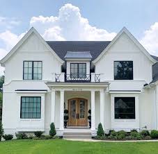 Black And White House With Wood Door Stephanie Florida Farmhouse On Instagram Lets Discuss This Exterior The Natural Wood Door Tak Brick Exterior House Painted Brick House White Brick Houses