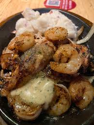 Dip shrimp in batter to coat. Chicken Shrimp And Mashed Potatoes From Applebee S Foodporn