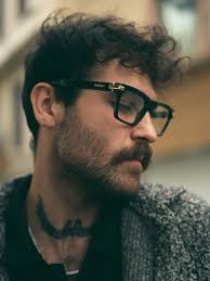 Man Sitting at a Table in Front of the House · Free Stock Photo