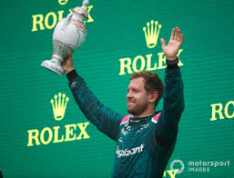Take a walk down the famous formula 1 grid before posing for a professional photo on the track with the authentic world championship trophies. Cw0b1vfqusqd M