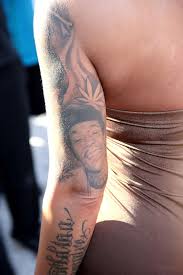 Wiz khalifa has a tattoo on his eyebrow which is a nautical symbol, that is a star. Jhene Aiko Gets Big Sean Tattoo