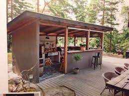 Rustic covered outdoor kitchen with bar | hgtv. Kesakeittio Outdoor Kitchen Design Rustic Outdoor Kitchens Outdoor Rooms