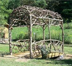 I Like That This One Is Made Out Of Branches Not This Big But The General Idea With Branches Around The Top Garden Arches Rustic Arbor Rustic Gardens