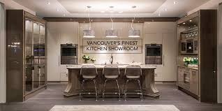 The juxtaposition of rustic cabinetry with the latest appliances and contemporary counters and touches creates a warm and inviting, modern kitchen space. Kitchen And Bathroom Design Ideas