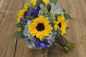 25 th wedding anniversary flowers the iris is the official 25 th wedding anniversary flower, and a blue iris delivery for that special couple to celebrate their love will be cherished and remembered for years to come. Sunflower And Blue Rose Wedding Bouquet Novocom Top