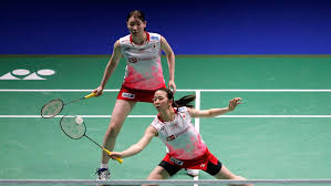 Badminton nets are typically made taut by the use of weighted tension poles on the outside edges of the badminton court. Badminton
