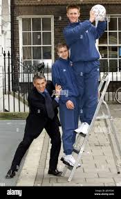 Former footballer and now TV presenter Gary Lineker gives England under-15  Internationals Danny Jeffreys of Chelsea (c) and Nick Eyre of Tottenham a  push up the footballing ladder. Walkers Crisps are to