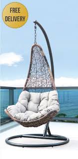Zero gravity metal outdoor patio reclining lounge chair with blue and gray cushion, cup holder and side table. Signature Aviary Hanging Chair Signature Rattan Alnwick Range Garden Furniture By Range For The Garden Hanging Chair Swinging Chair Hanging Swing Chair