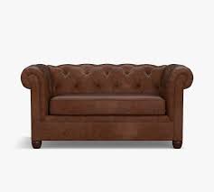 Everly contemporary sofa in genuine leather with brushed stainless steel legs. Chesterfield Leather Sofa Pottery Barn