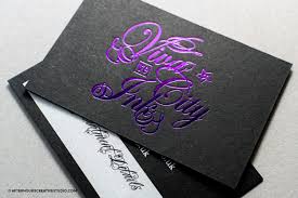 The dark color scheme lends itself well to formality, and can be tailored toward elegance or masculinity. Black Vanguard Business Card With White Ink Printing And Purple Foiling
