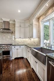 Hardwood Laminate Flooring For Kitchen White Cabinets Hardwood Floors And That Backsplash Classic White Kitchen Kitchen Design Kitchen Remodel