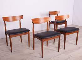 Born in 1921, his distinctive designs feature comfortable materials and simplistic lines, with circular seats and pointed legs. Set Of 4 Vintage Teak Dining Chairs By Ib Kofod Larsen For G Plan 1960s 134584