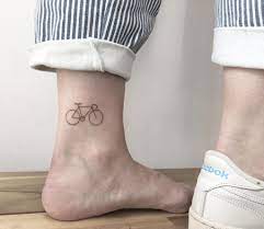 Just add various colors to your simple black tattoo, and you will get absolutely new one. Minimalist Tiny Bicycle Tattoo By Vivien Szincsak