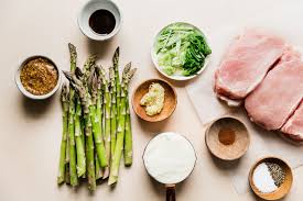 Baked Boneless Pork Chop And Asparagus Sheet Pan The Modern Proper Recipe Boneless Pork Chops Baked Boneless Pork Chops Fish Stew Recipes