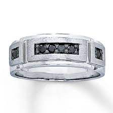 This Impressive Men S Band Features Black Diamonds This Unique And Masculine Ring Is Set In 10k Mens Black Diamond Rings Black Diamond Ring Mens Wedding Rings