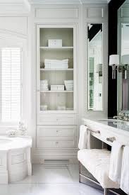 With a variety of colors and styles, you are sure to complement your bathroom decor. Wainscoted Tub With Glass Door Inset Linen Cabinet Transitional Bathroom