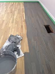 Oak Floors Stained Blue Gray Staining Is Always The Best Part But Can Also Be Dange Gray Hardwood Floor Stain Hardwood Floor Stain Colors Staining Wood Floors