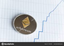 Gold Ethereum Cryptocurrency Coin On Spiking Blue Line Graph