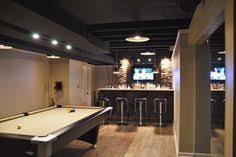 However, a black ceiling can make a space feel a little more cozier because it allows the furnishings to stand out and the dark ceiling allows the space to blend. 37 Basement Ceiling Blackout Ideas Basement Ceiling Finishing Basement Basement Remodeling