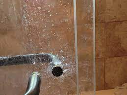How To Remove Soap Scum And Hard Water Stains From Shower Glass Doors Everyday Simple Cleaning Glass Shower Doors Cleaning Glass Glass Shower